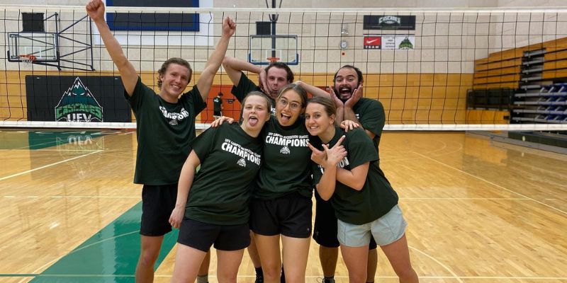 A team celebrates their volleyball win