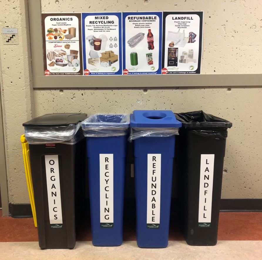 Four bins - one for landfill, one for compostables, recycling, refundables