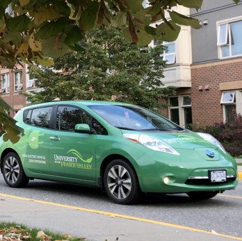 An electric vehicle painted in UFV green