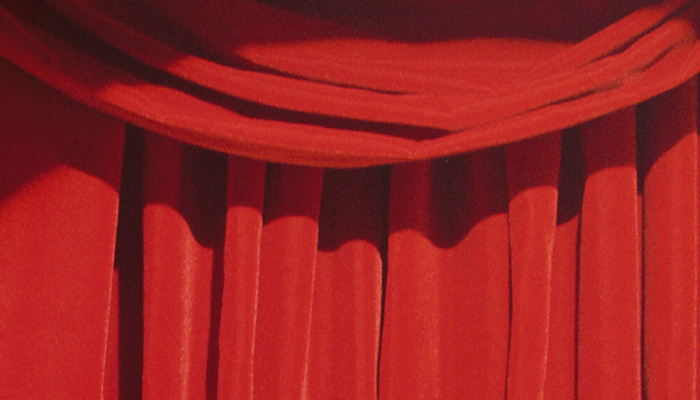 Closed red theatre curtain.